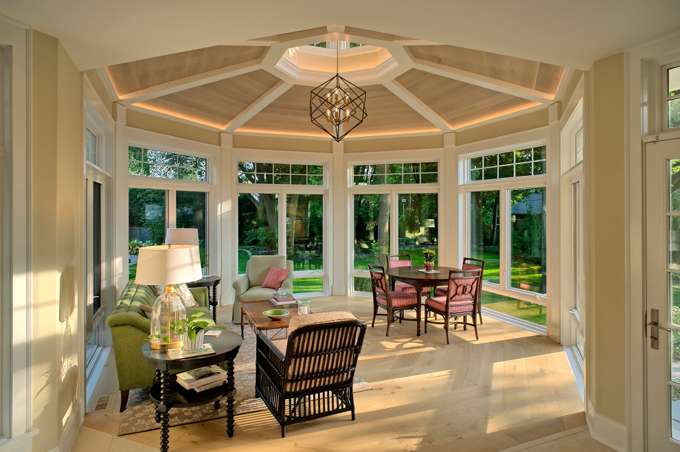 Design ideas for a mid-sized transitional sunroom in Chicago with light hardwood floors and beige floor.