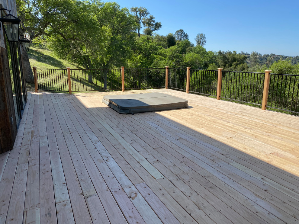 Deck - mid-sized rustic backyard ground level mixed material railing deck idea in San Luis Obispo with no cover