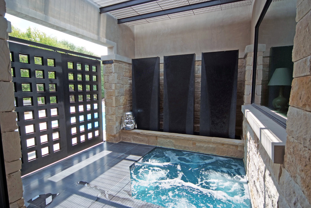 Inspiration for an asian pool in Dallas with a hot tub.