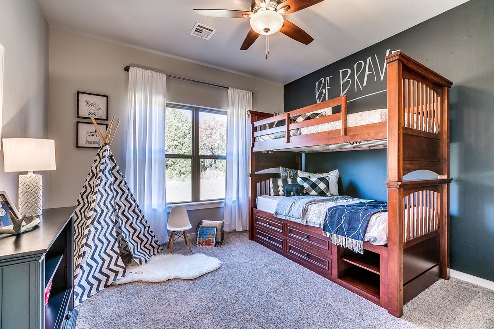 Design ideas for a transitional gender-neutral kids' bedroom for kids 4-10 years old in Oklahoma City with beige walls, carpet and beige floor.