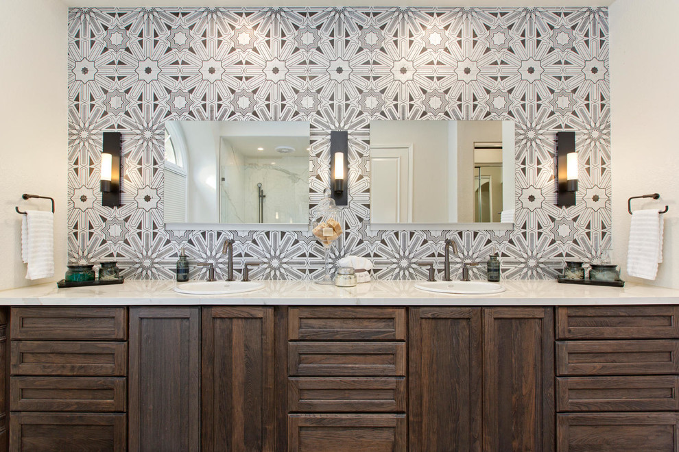 Freestanding bathtub - large master gray tile and terra-cotta tile freestanding bathtub idea in Denver with recessed-panel cabinets, distressed cabinets, a wall-mount toilet, an undermount sink and quartz countertops