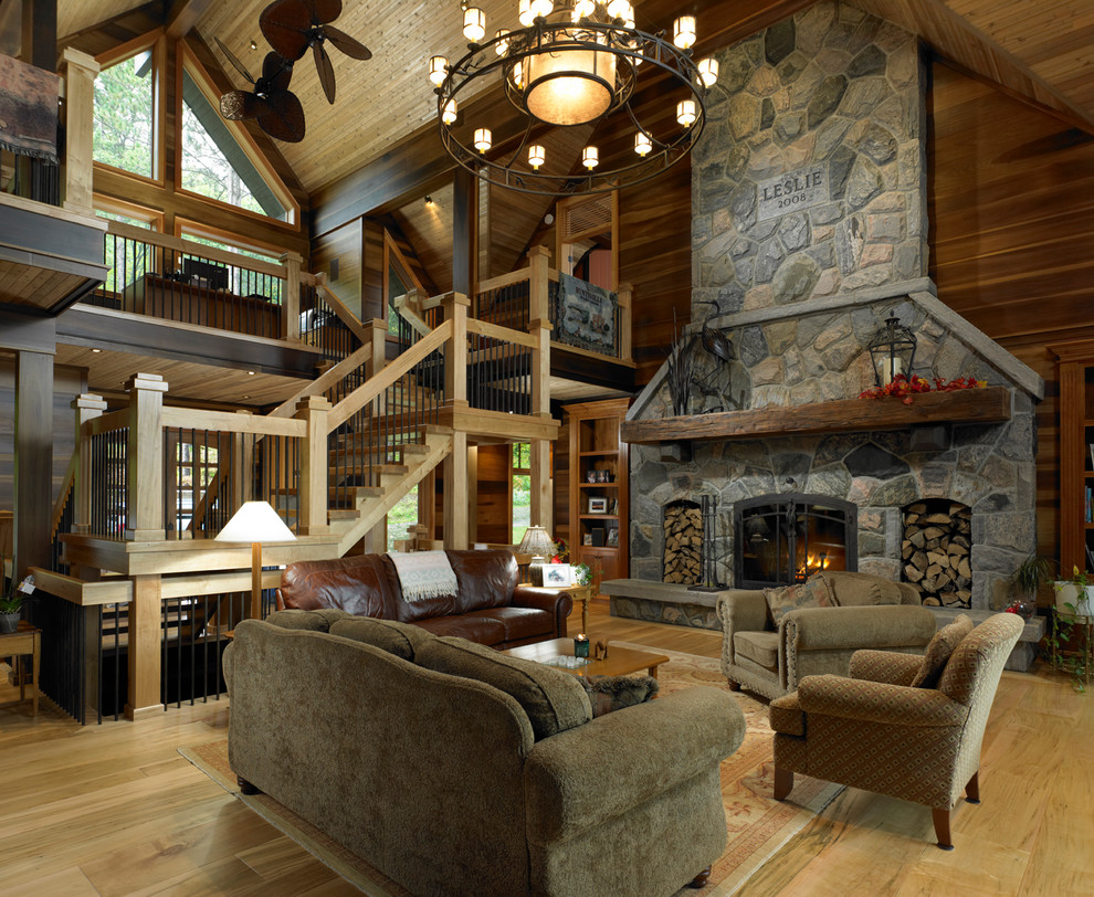 Large traditional living room in Seattle with a standard fireplace and a stone fireplace surround.