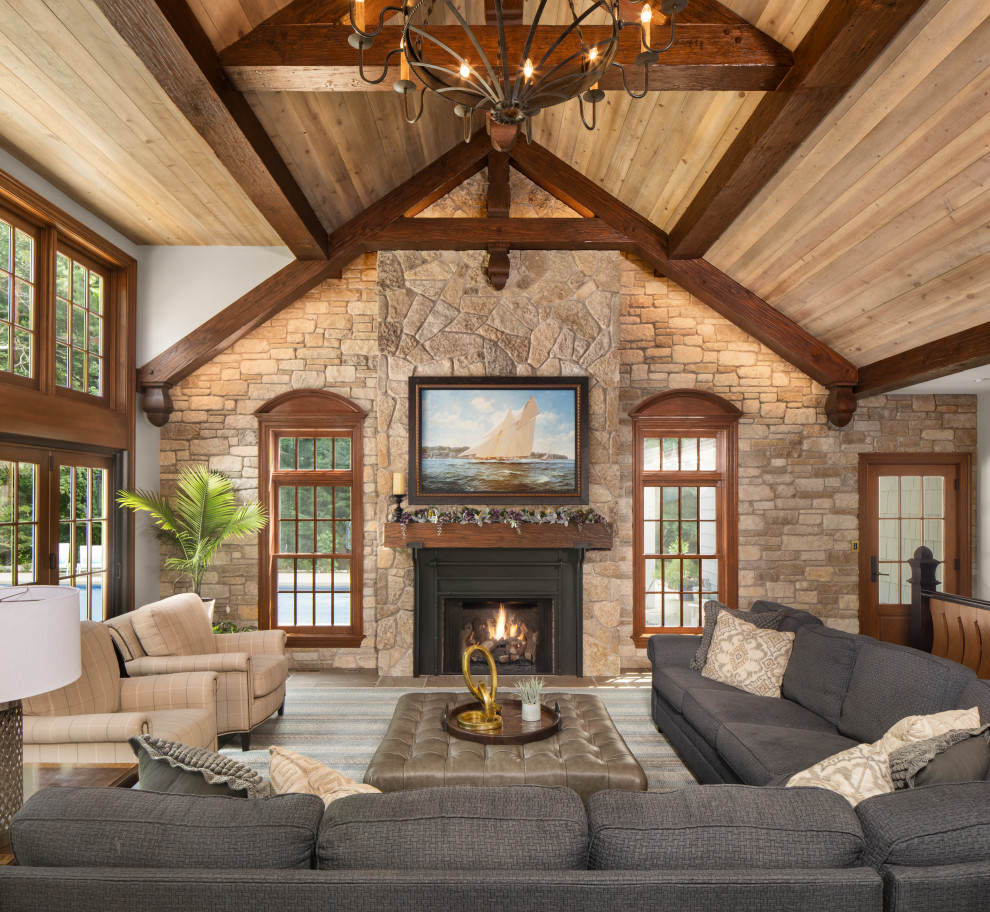 Living room - rustic exposed beam, vaulted ceiling and wood ceiling living room idea in Minneapolis with white walls, a standard fireplace and a metal fireplace
