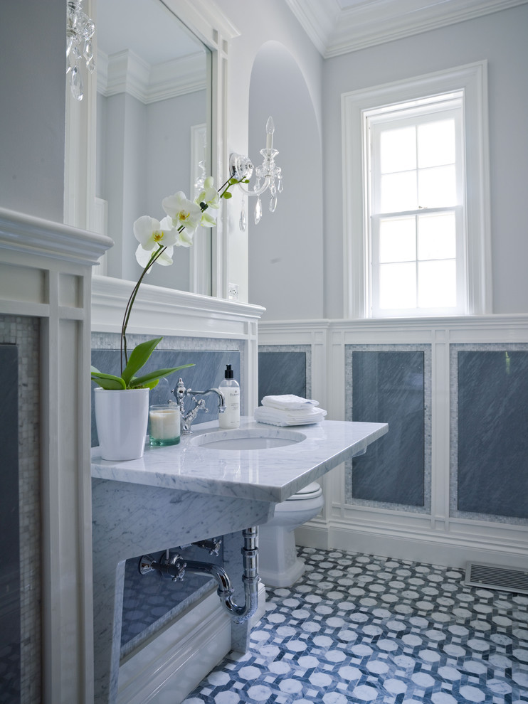 Design ideas for a traditional bathroom in New York with marble benchtops and mosaic tile.