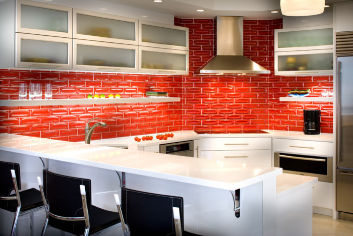 Inspiration for a contemporary u-shaped eat-in kitchen in Tampa with an undermount sink, louvered cabinets, white cabinets, red splashback, stainless steel appliances and a peninsula.