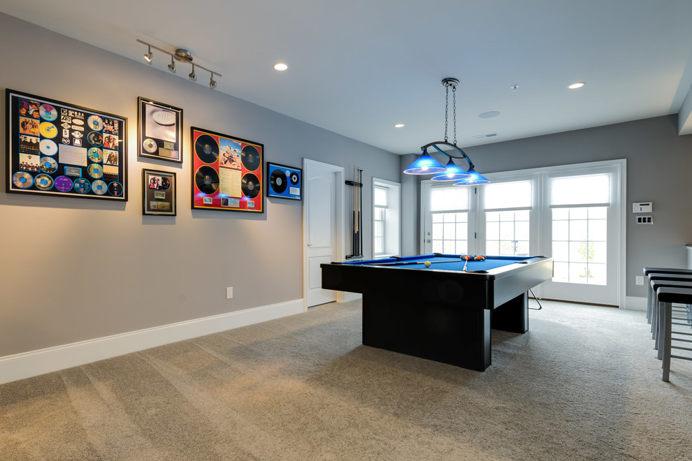This is an example of a mid-sized contemporary open concept family room in Baltimore with a game room, beige walls, carpet, no fireplace, no tv and beige floor.