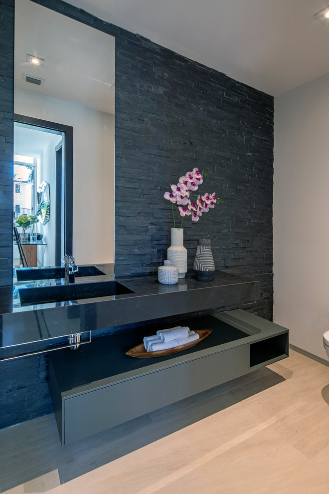 Inspiration for a beach style bathroom in Miami with black cabinets, black tile, slate, white walls, limestone floors, marble benchtops, beige floor and black benchtops.