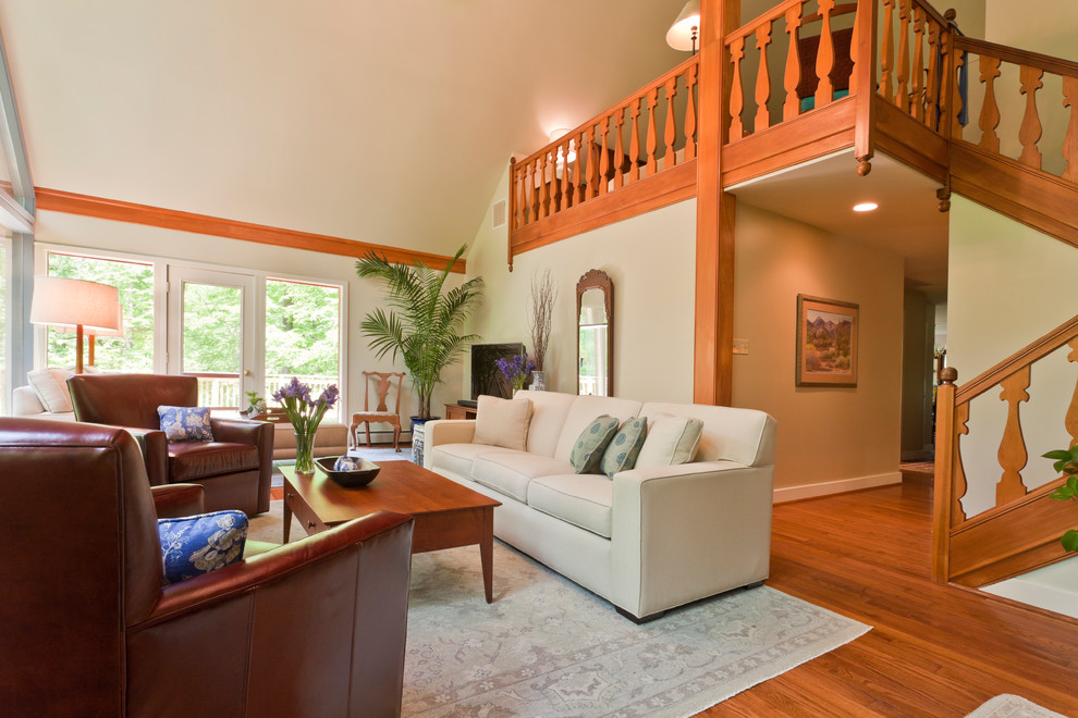 Mid-sized transitional open concept and formal medium tone wood floor living room photo in Philadelphia with beige walls, a tv stand and no fireplace