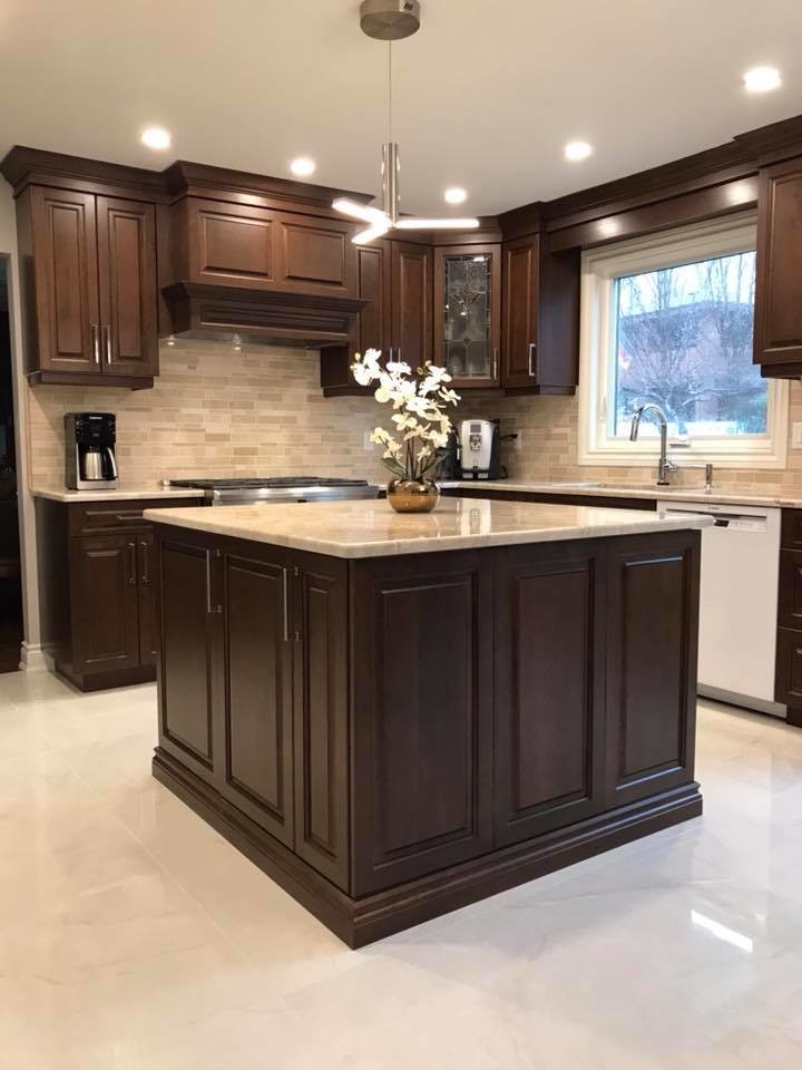 Eat-in kitchen - large transitional u-shaped marble floor and beige floor eat-in kitchen idea with an undermount sink, raised-panel cabinets, beige cabinets, quartzite countertops, beige backsplash, marble backsplash, stainless steel appliances and an island