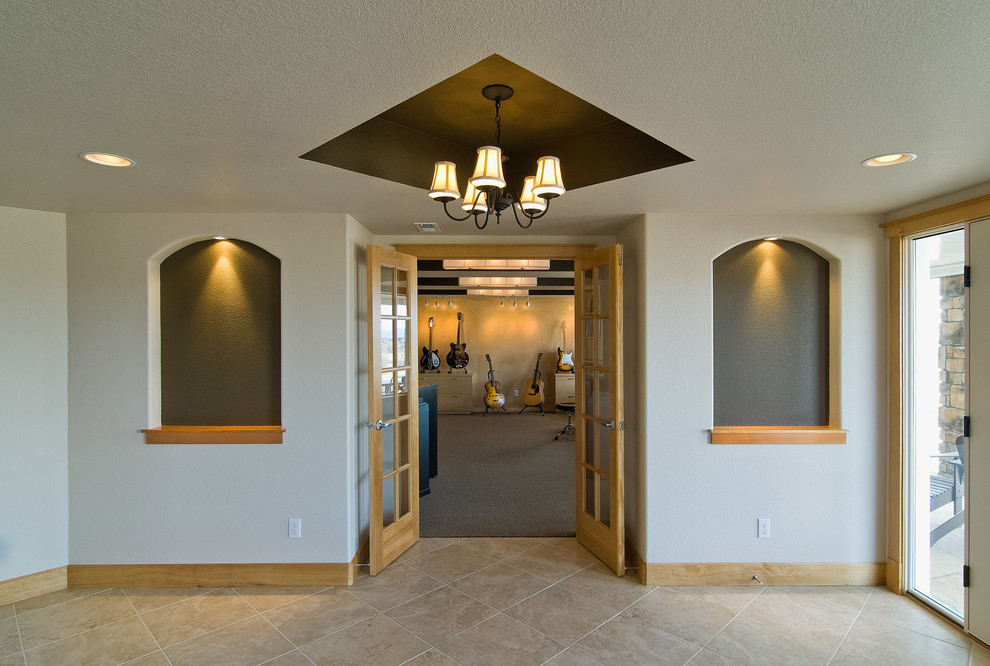 Example of a large transitional look-out carpeted and gray floor basement design in Denver with gray walls and no fireplace