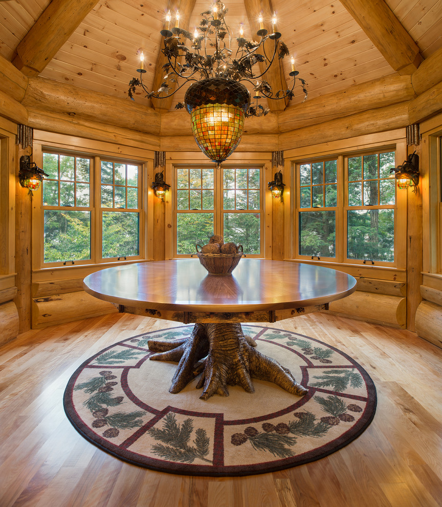 Photo of a country dining room in New York with medium hardwood floors.