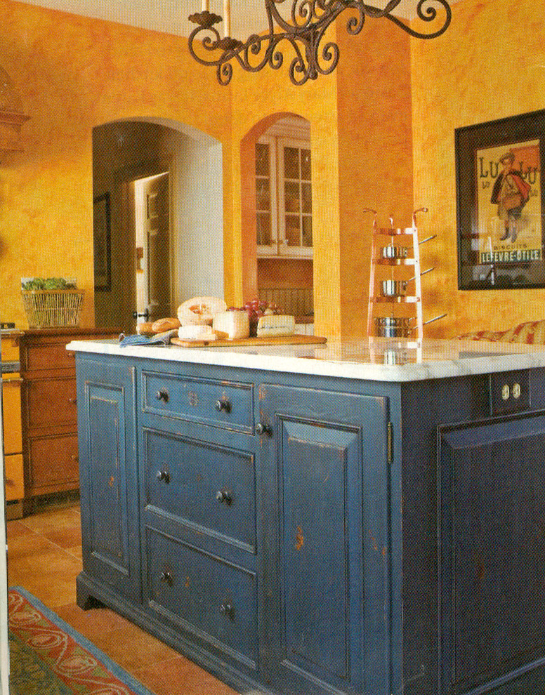 Design ideas for a large country u-shaped kitchen pantry in New York with an undermount sink, beaded inset cabinets, distressed cabinets, marble benchtops, yellow splashback, terra-cotta floors and with island.