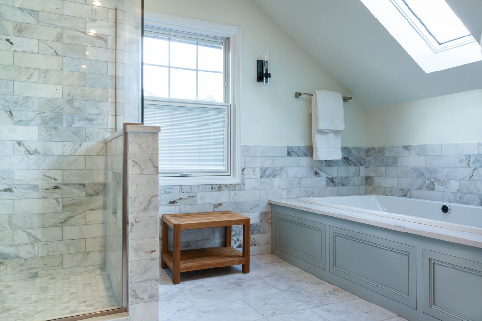 Photo of a large traditional master bathroom in Chicago with beaded inset cabinets, blue cabinets, an alcove tub, a corner shower, a two-piece toilet, white walls, porcelain floors, an undermount sink, engineered quartz benchtops, white floor, a hinged shower door and white benchtops.