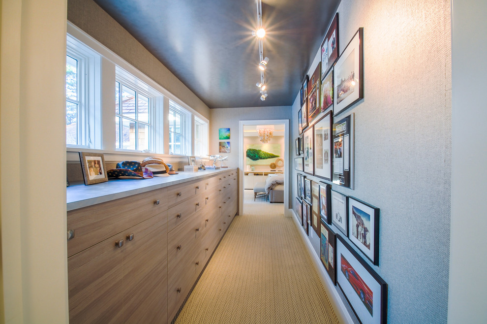 This is an example of a mid-sized beach style hallway in Minneapolis with grey walls and carpet.