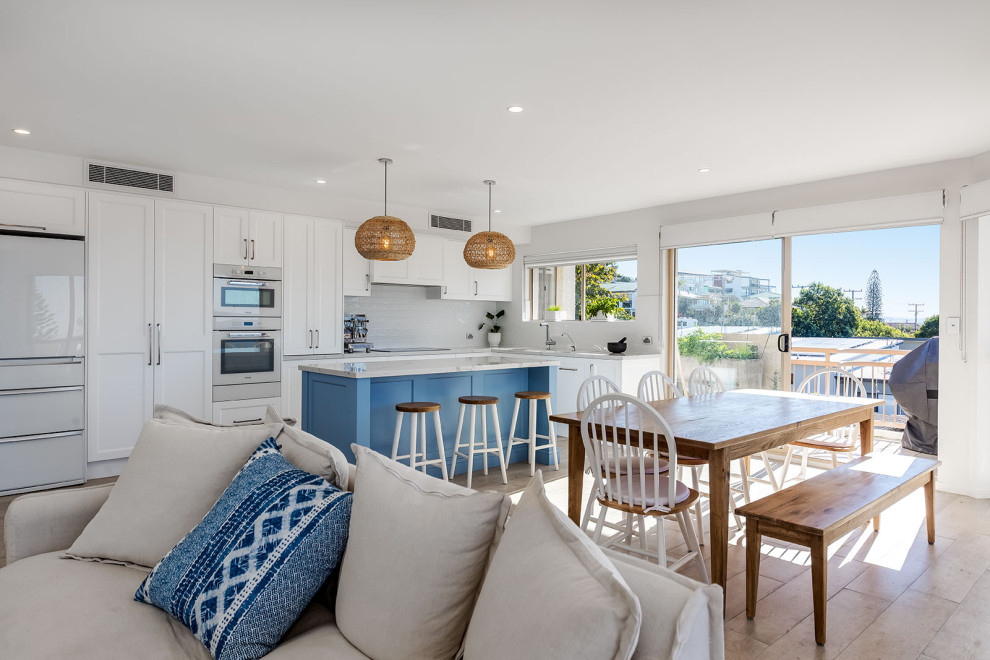 Design ideas for a mid-sized beach style open concept living room in Sunshine Coast with white walls.