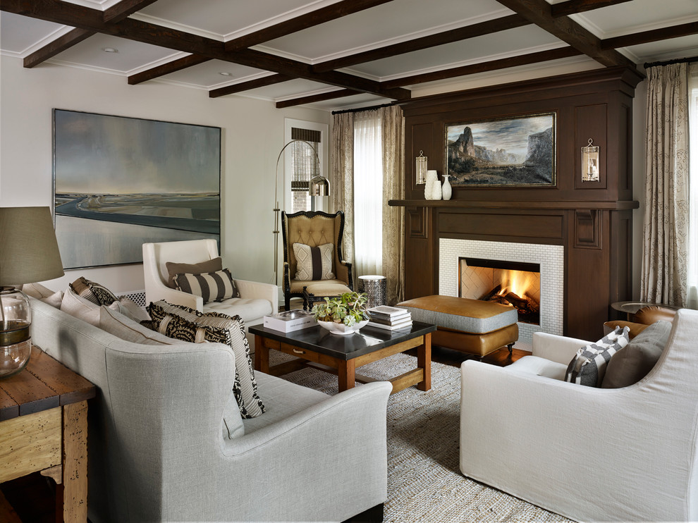 This is an example of a traditional living room in Denver with a standard fireplace, a tile fireplace surround and no tv.