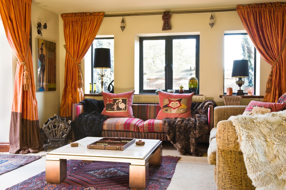 Design ideas for a large eclectic enclosed living room with yellow walls, carpet and a freestanding tv.