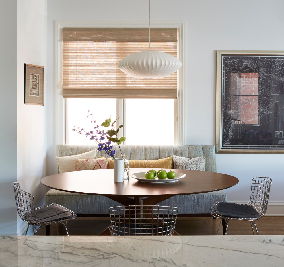 Inspiration for a contemporary dining room remodel in Chicago with white walls