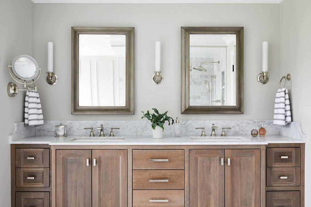 Photo of a mid-sized traditional master bathroom in New York with shaker cabinets, distressed cabinets, an undermount tub, a shower/bathtub combo, a one-piece toilet, white tile, marble, grey walls, marble floors, a vessel sink, marble benchtops, white floor, an open shower and white benchtops.