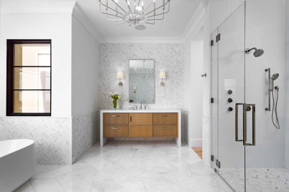 Photo of a large transitional master bathroom in Phoenix with recessed-panel cabinets, light wood cabinets, a freestanding tub, an open shower, a bidet, gray tile, marble, white walls, marble floors, an integrated sink, marble benchtops, white floor, an open shower, white benchtops, a shower seat, a double vanity, a floating vanity, coffered and decorative wall panelling.