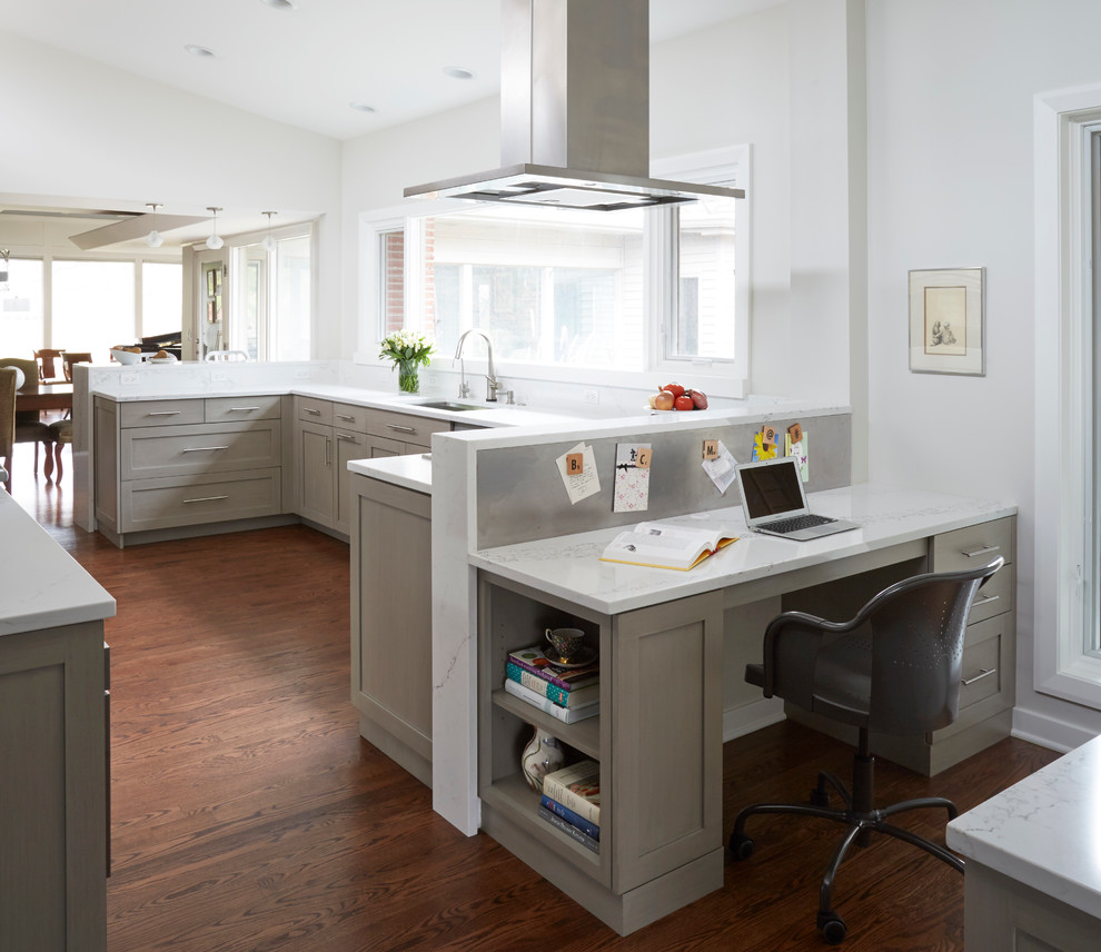 Eat-in kitchen - large transitional u-shaped medium tone wood floor and brown floor eat-in kitchen idea in Chicago with a single-bowl sink, shaker cabinets, gray cabinets, quartz countertops, white backsplash, ceramic backsplash, stainless steel appliances and a peninsula
