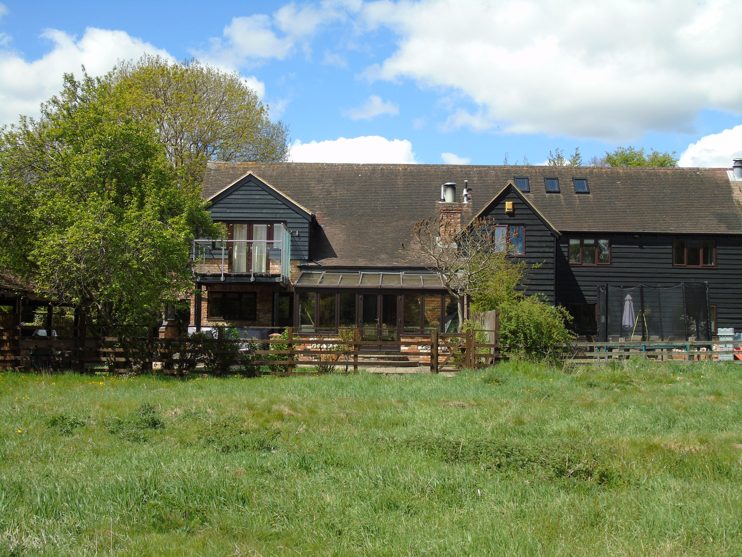 Rear view of completed barn conversion with balcony