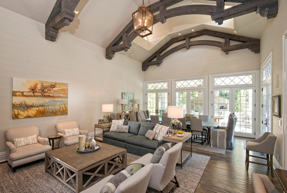 Photo of a large traditional open concept family room in Other with white walls, medium hardwood floors and a built-in media wall.