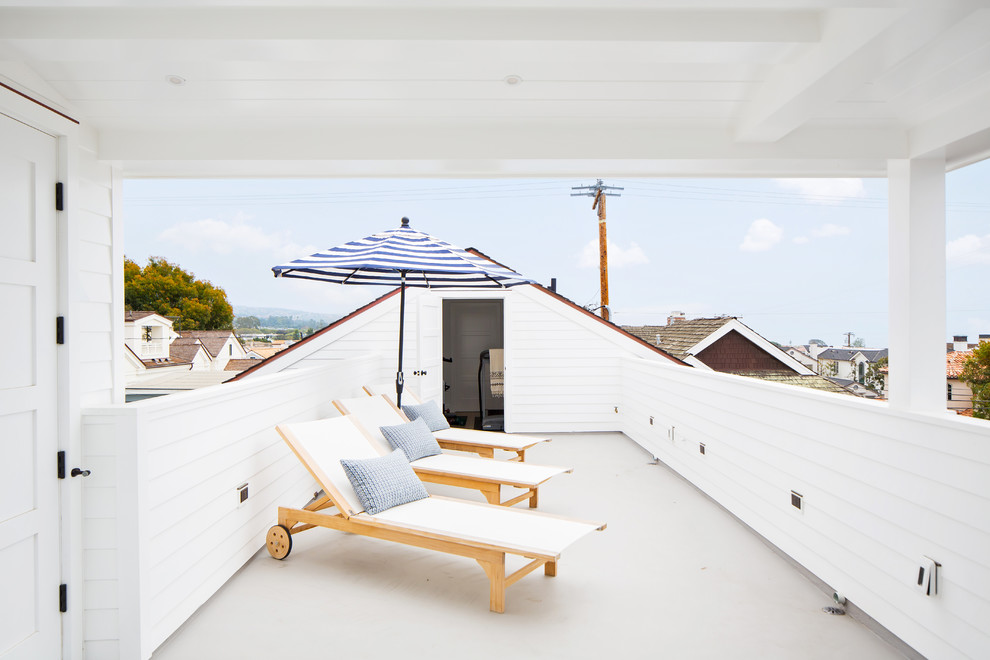Photo of a beach style rooftop and rooftop deck in Los Angeles with a roof extension.