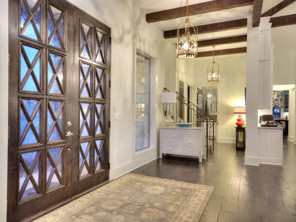 Transitional dark wood floor foyer photo in Austin with white walls and a glass front door