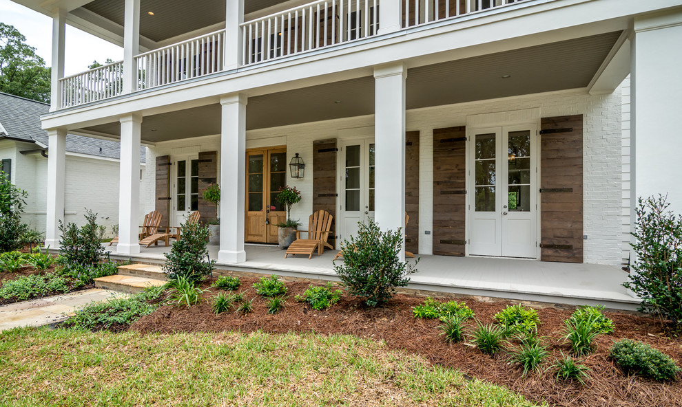 Design ideas for a large country two-storey white exterior in New Orleans.