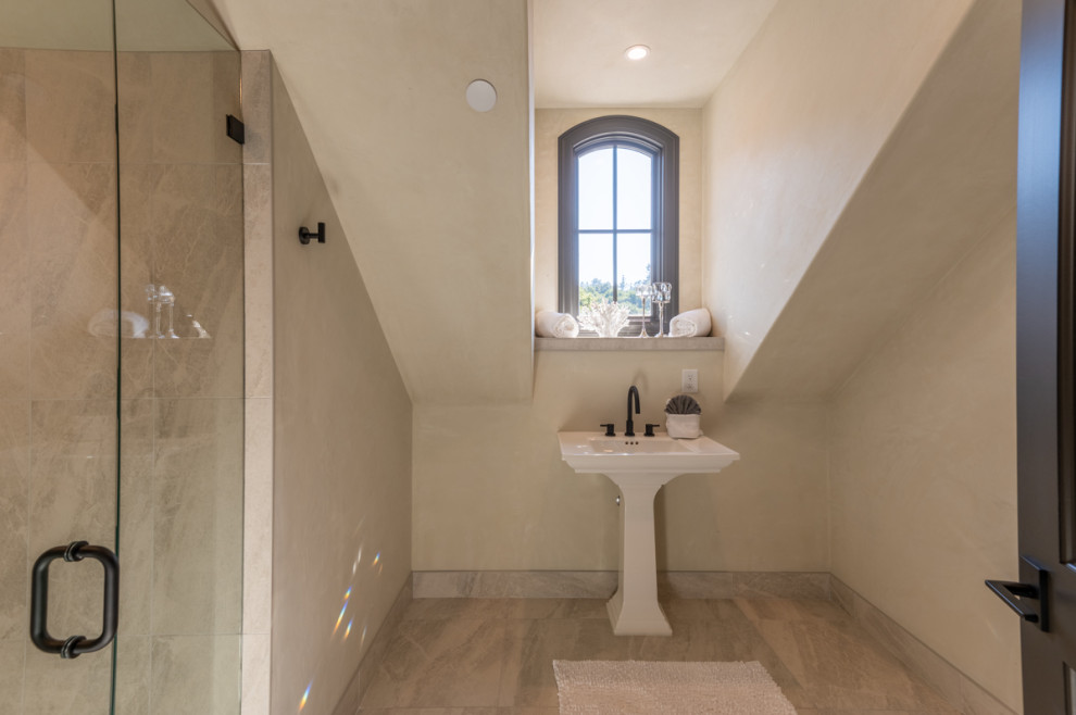 Photo of an expansive kids bathroom in Other with a corner shower, beige tile, beige walls, a pedestal sink, brown floor, a hinged shower door, a shower seat and a single vanity.