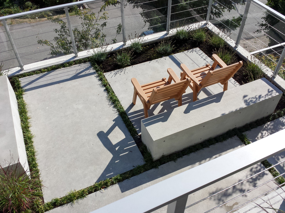 Inspiration for a contemporary deck in Vancouver with a container garden and no cover.