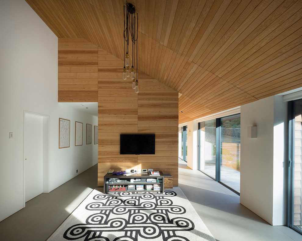 Inspiration for a medium sized nautical mezzanine games room in Devon with brown walls, ceramic flooring, a wall mounted tv and grey floors.