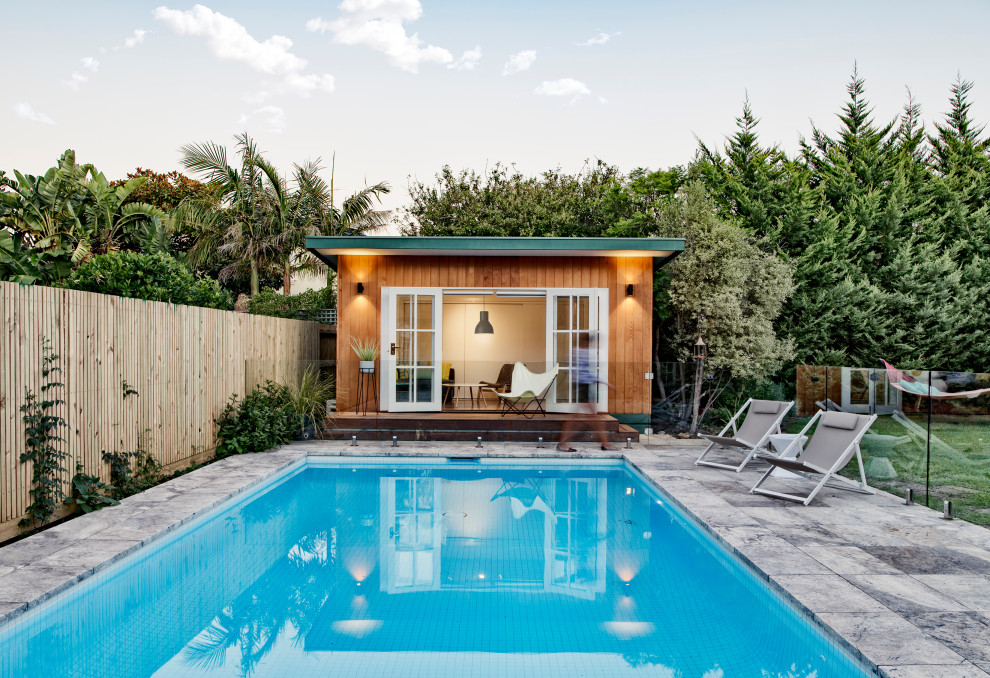 Design ideas for a contemporary rectangular pool in Melbourne with a pool house.