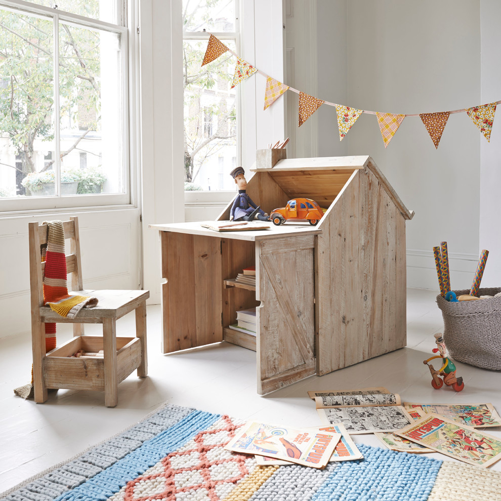 Design ideas for a small contemporary gender-neutral kids' bedroom for kids 4-10 years old in London with beige walls and painted wood floors.