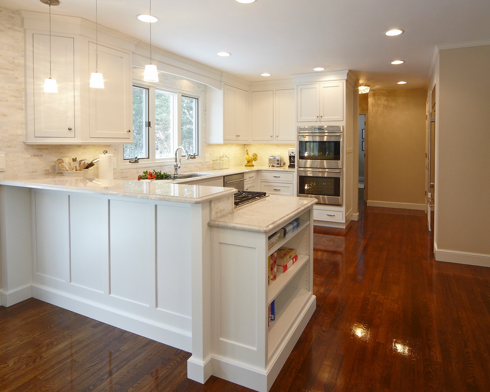 Design ideas for a mid-sized transitional u-shaped eat-in kitchen in Boston with an undermount sink, beaded inset cabinets, white cabinets, stainless steel appliances, dark hardwood floors, no island and quartzite benchtops.