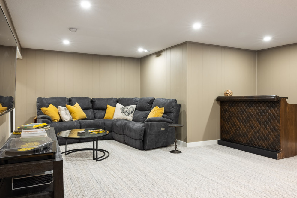 Example of a transitional home design design in Calgary