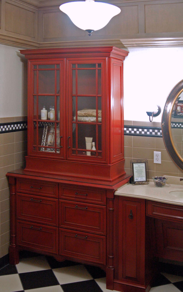 Mid-sized traditional bathroom in San Luis Obispo with recessed-panel cabinets, red cabinets, gray tile, ceramic tile, ceramic floors, an integrated sink, solid surface benchtops, multi-coloured floor, beige benchtops, a single vanity, a built-in vanity and decorative wall panelling.
