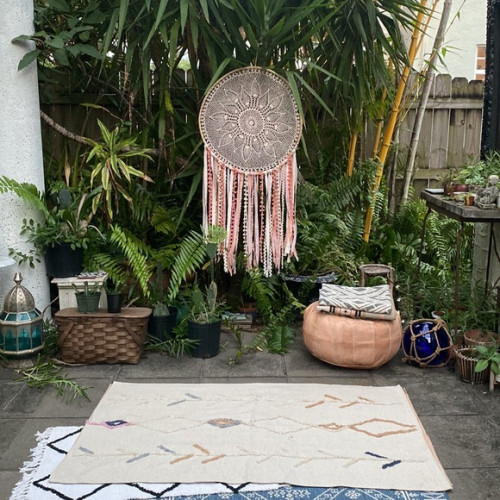 Boho Patio Furniture Ideas; The boho patio furniture ideas in this post include eclectic patio chairs, wall decor with rustic appeal, and even boho metal planters for your garden!