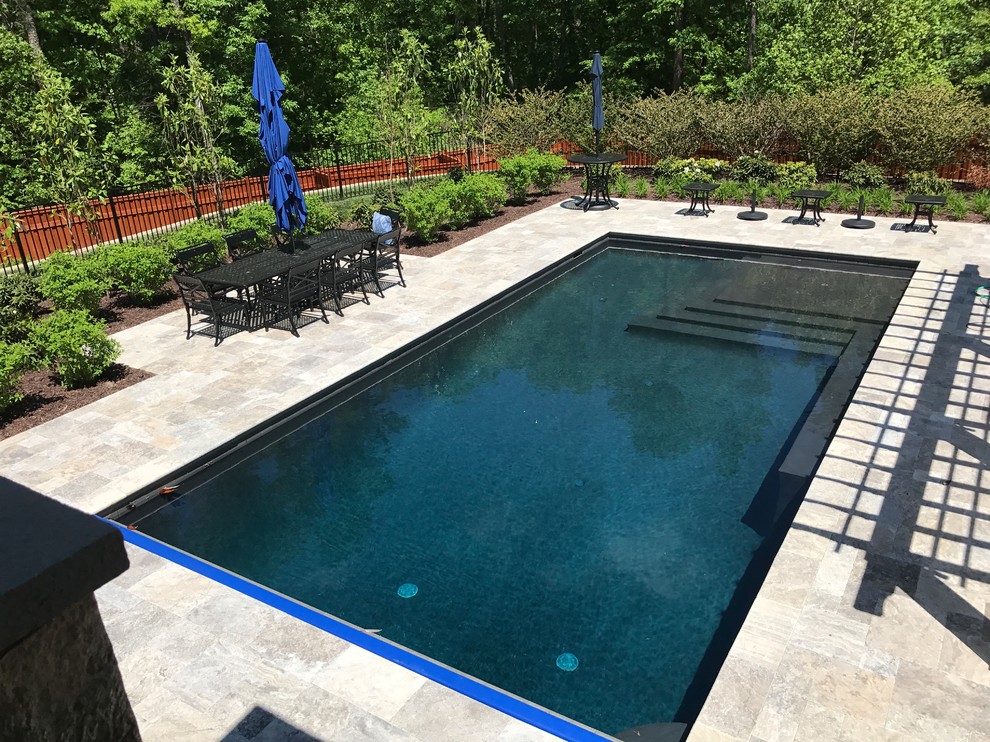 Huge transitional backyard stone and rectangular natural pool photo in Richmond