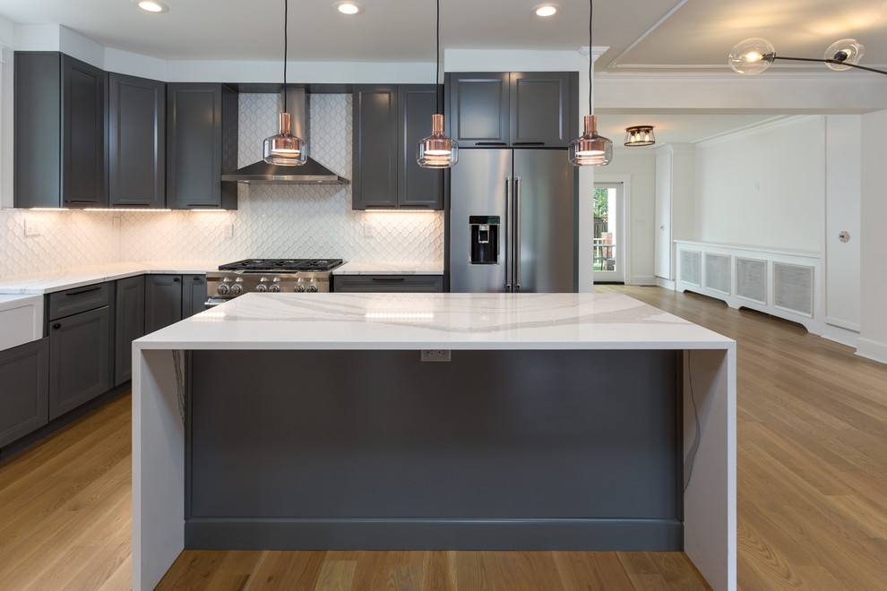 This is an example of a mid-sized transitional kitchen in DC Metro.