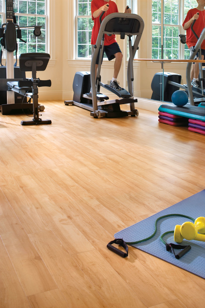 Photo of a contemporary home gym in San Diego with vinyl floors and beige floor.