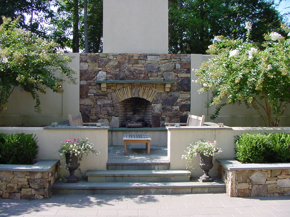 This is an example of a traditional patio in Richmond with a fire feature.