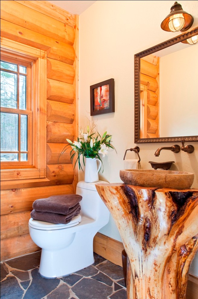 Design ideas for a country powder room in Other with a vessel sink and a one-piece toilet.