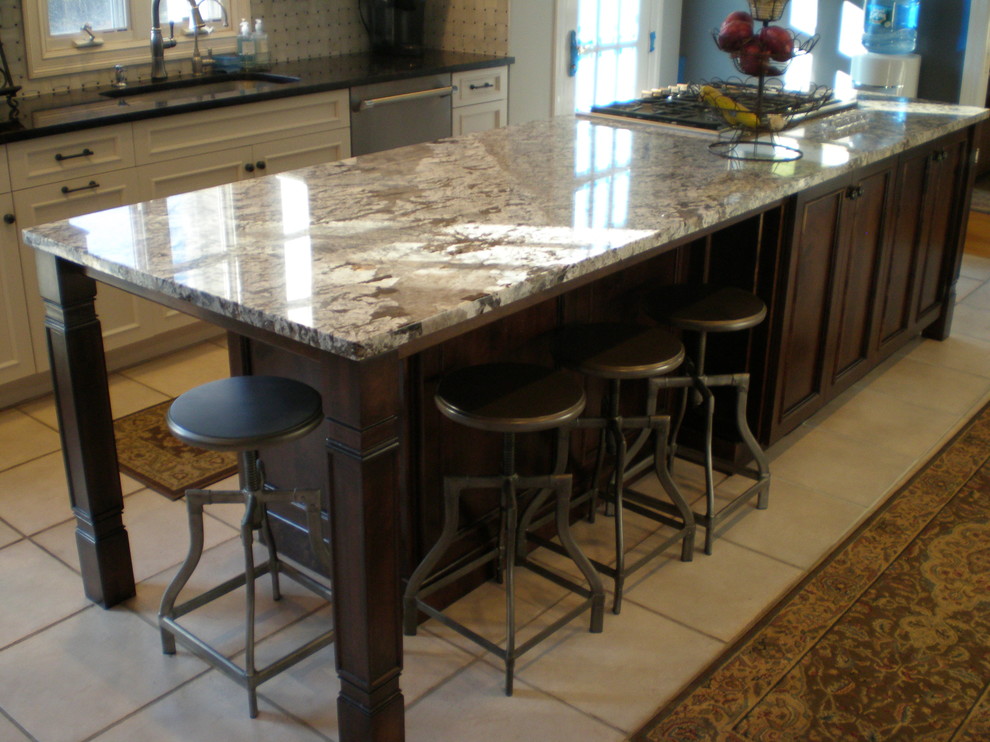 Example of a large classic single-wall ceramic tile open concept kitchen design in New York with an undermount sink, shaker cabinets, white cabinets, granite countertops, multicolored backsplash, mosaic tile backsplash, stainless steel appliances and an island