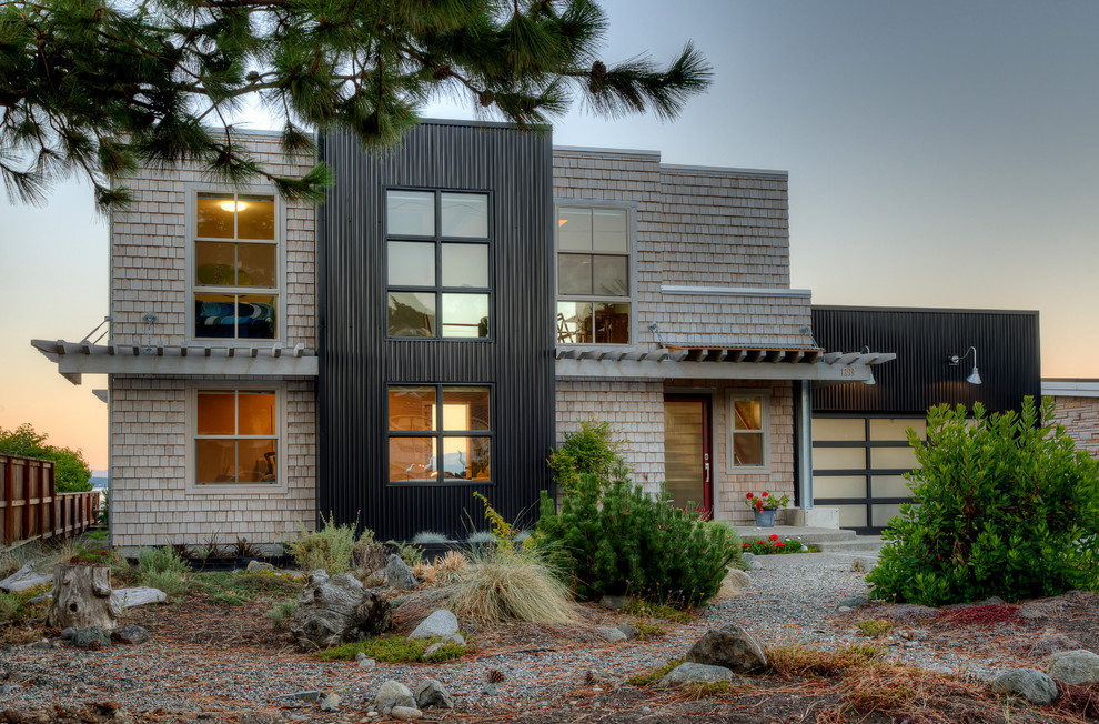 Mid-sized modern brown two-story mixed siding exterior home idea in Seattle with a metal roof