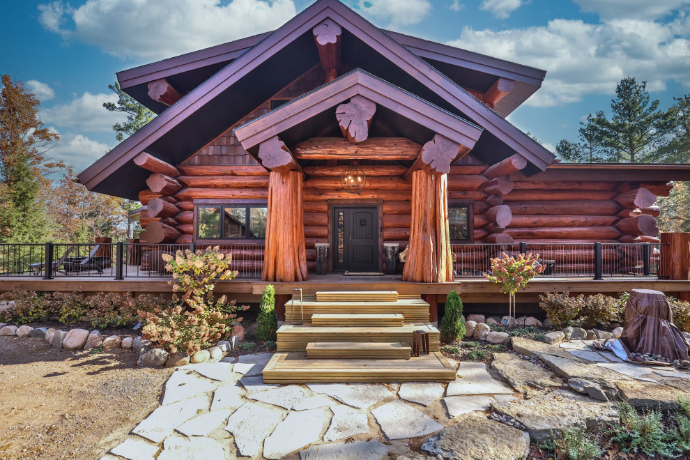 Mid-sized rustic brown three-story wood gable roof idea with a shingle roof and a brown roof