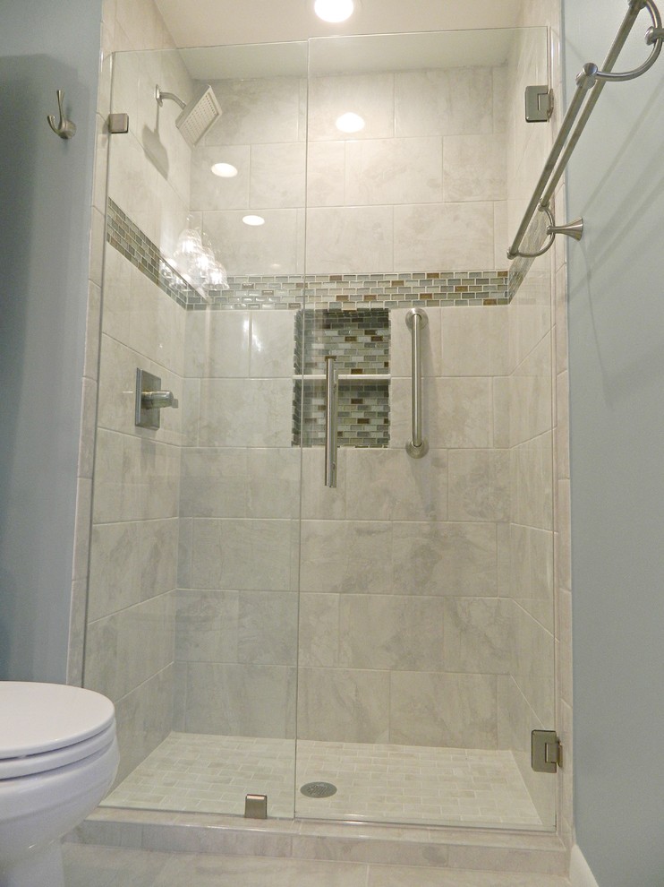 Mid-sized transitional 3/4 gray tile and stone tile porcelain tile alcove shower photo with shaker cabinets, gray cabinets, a one-piece toilet, blue walls, a vessel sink and quartz countertops