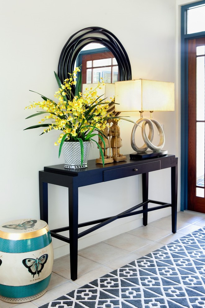 Photo of a transitional entryway in Brisbane with white walls and ceramic floors.