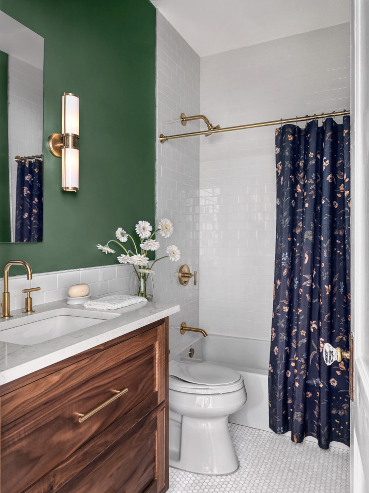 This is an example of a small transitional kids bathroom in St Louis with dark wood cabinets, a drop-in tub, a shower/bathtub combo, a two-piece toilet, white tile, subway tile, green walls, an undermount sink, engineered quartz benchtops, white floor, a shower curtain, white benchtops, a single vanity and a built-in vanity.